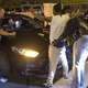 Police search a woman and car in Chicago.